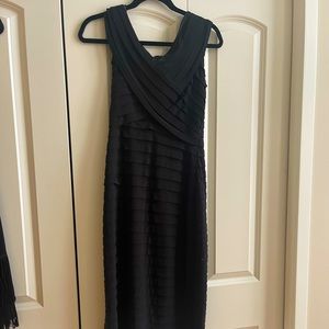 Beautiful mint condition black cocktail dress.  Cache size 6